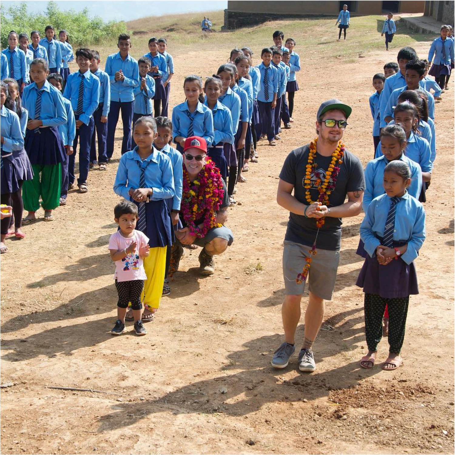 Kyle Sawyer with group of Nepalese school children