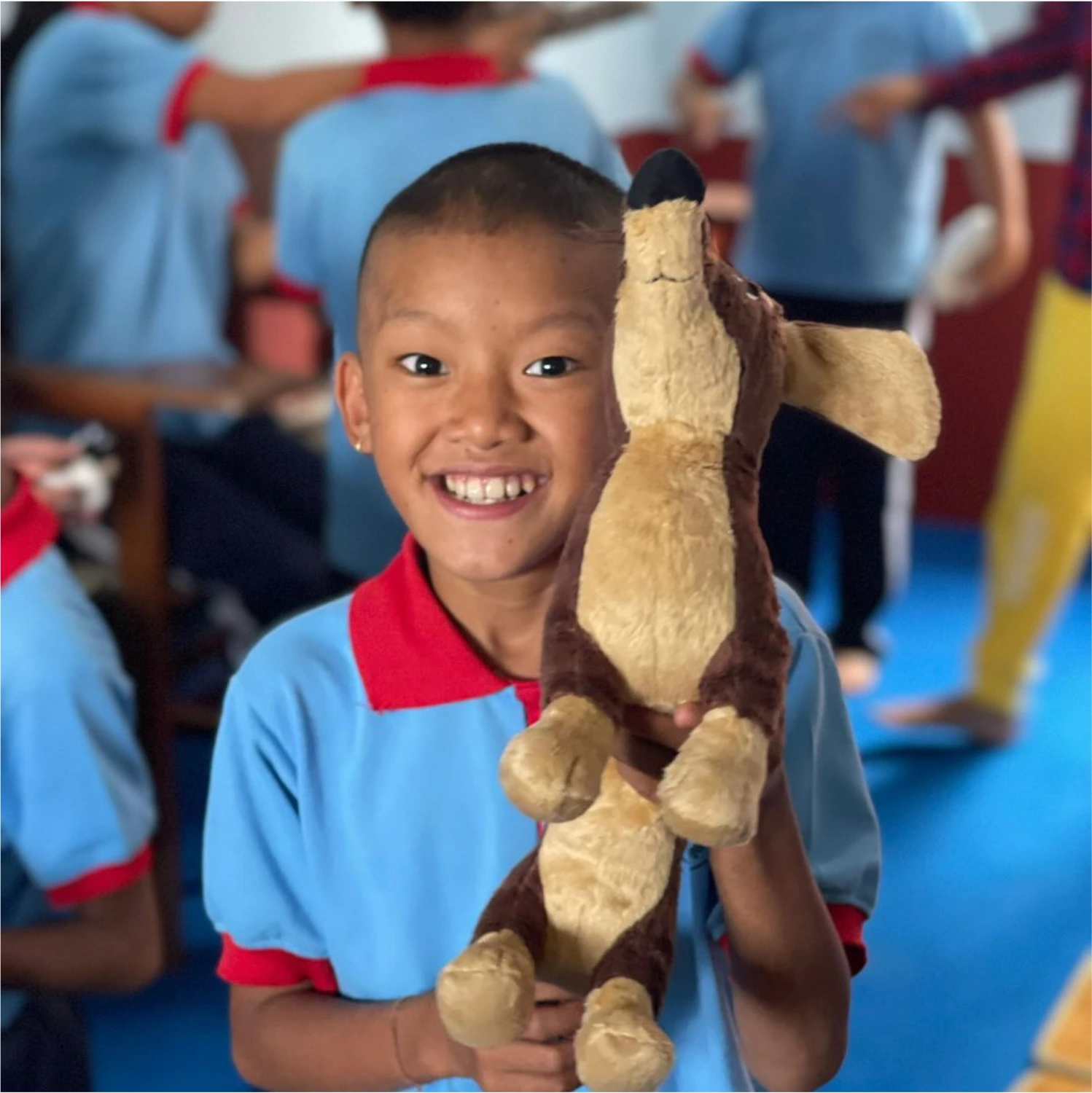 A young student in Nepal smiling at the camera