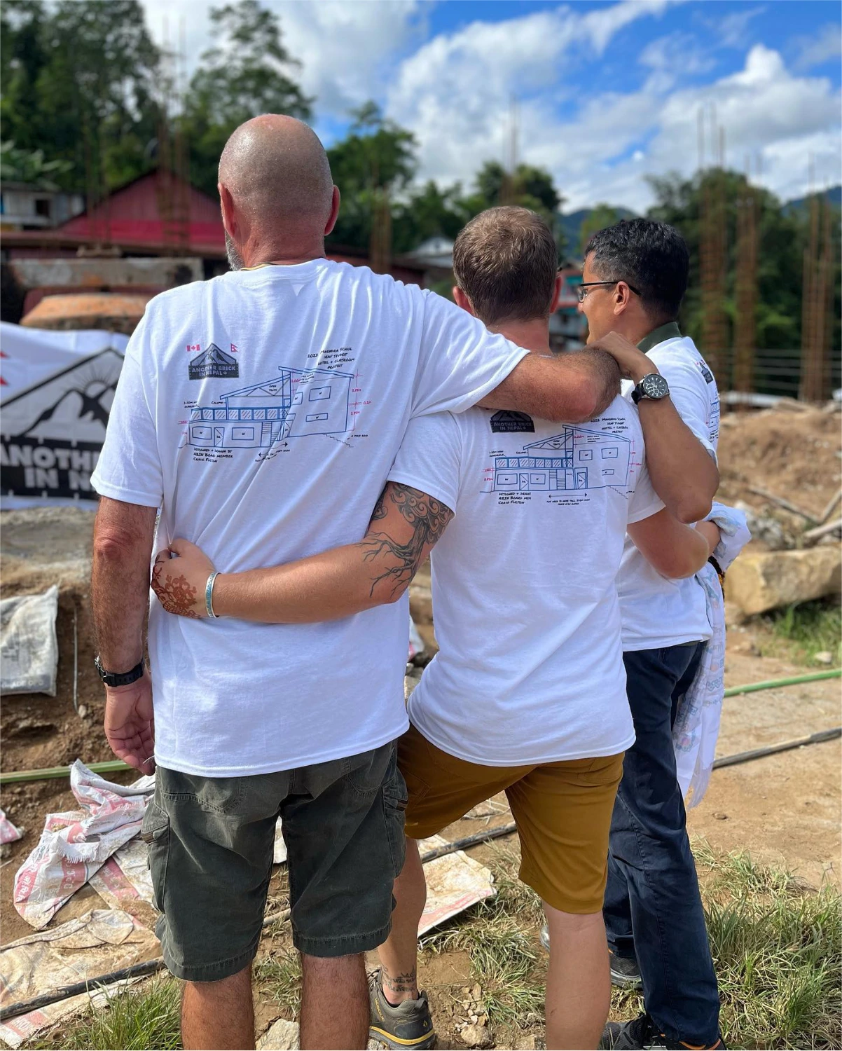 Another Brick in Nepal supporters hugging each other